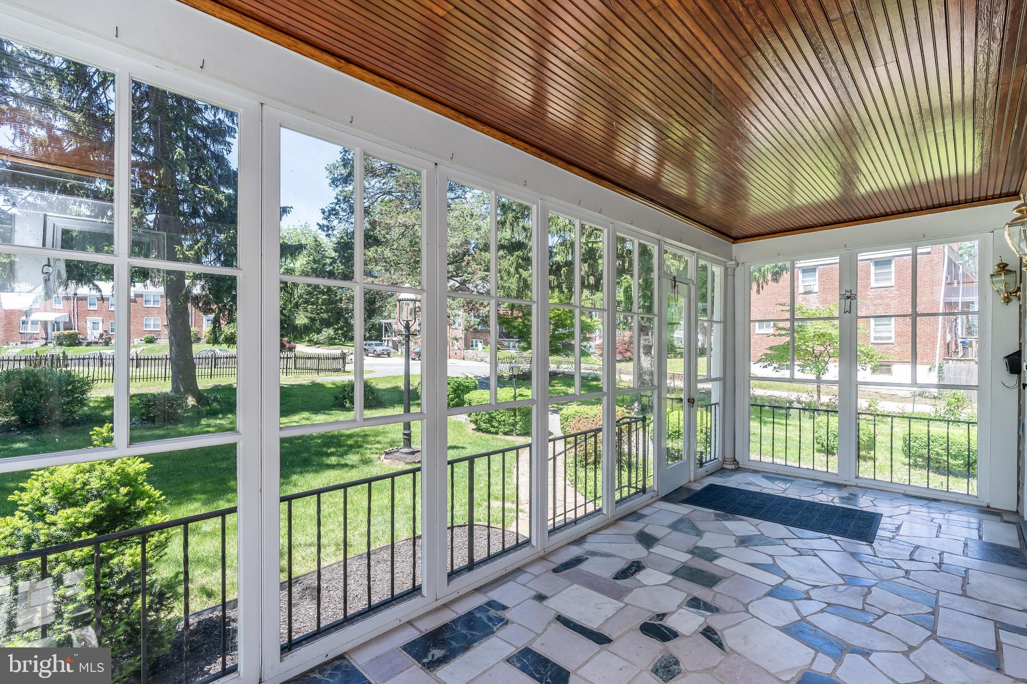137 Cherrydell Road Baltimore, MD 21228 - Photo 4 of 44 Large front porch with removable glass windows