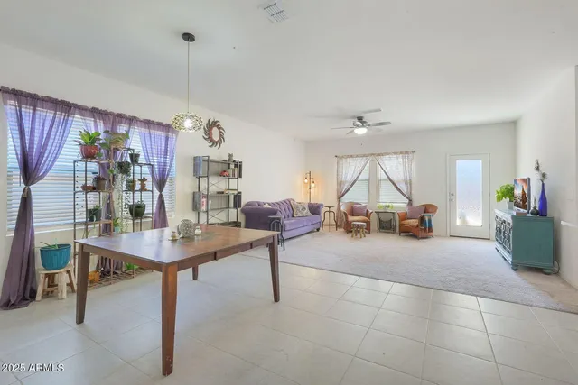 a view of a livingroom with furniture and window