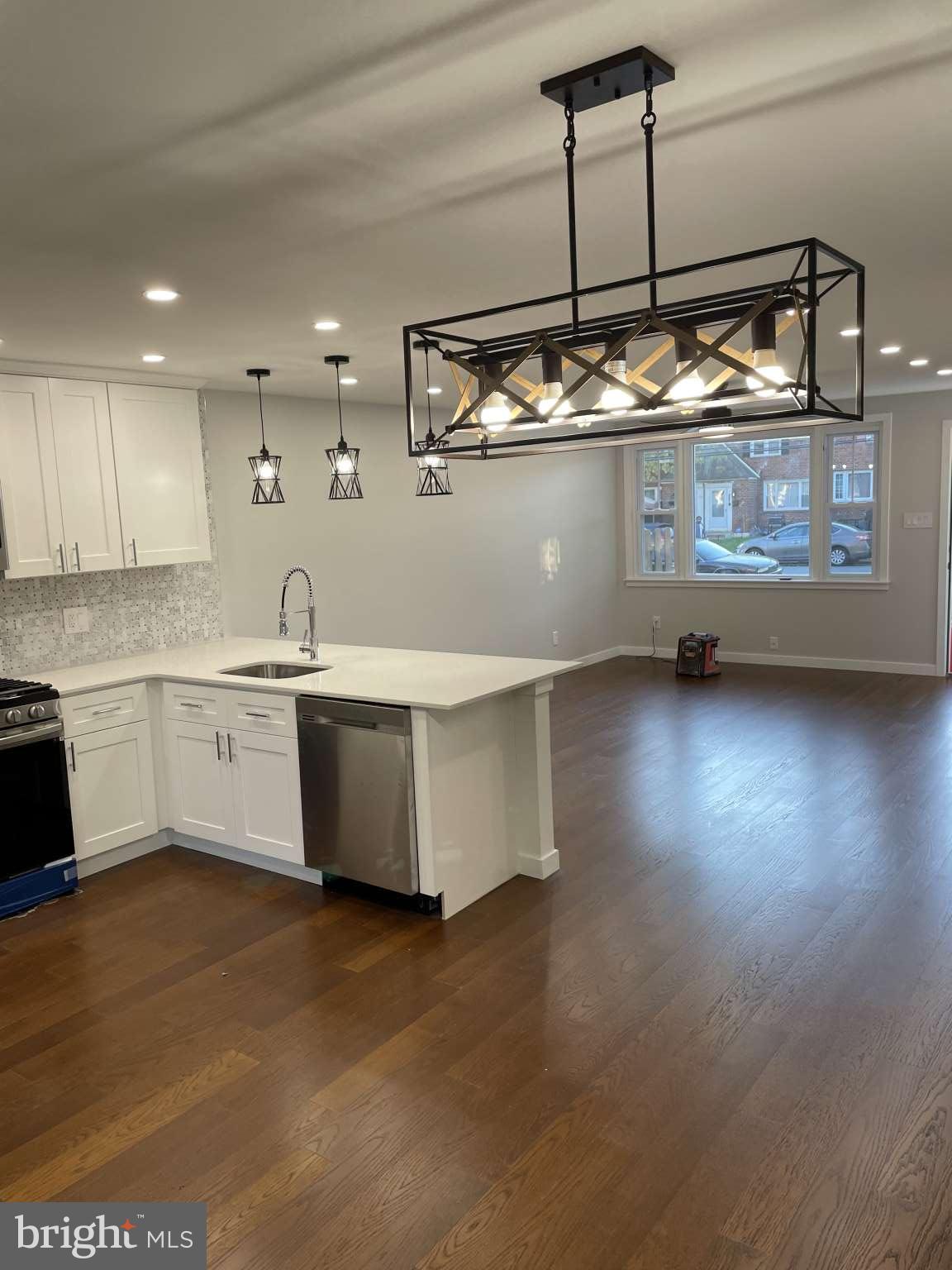 1305 Elson Road Brookhaven, PA 19015 - Photo 4 of 9 a kitchen with kitchen island a sink and stove