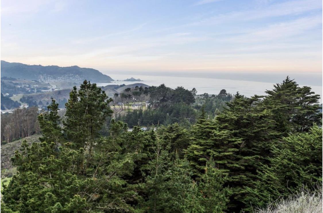 129 Outlook Circle Pacifica, CA 94044 - Photo 1 of 52 an aerial view of mountain with trees around