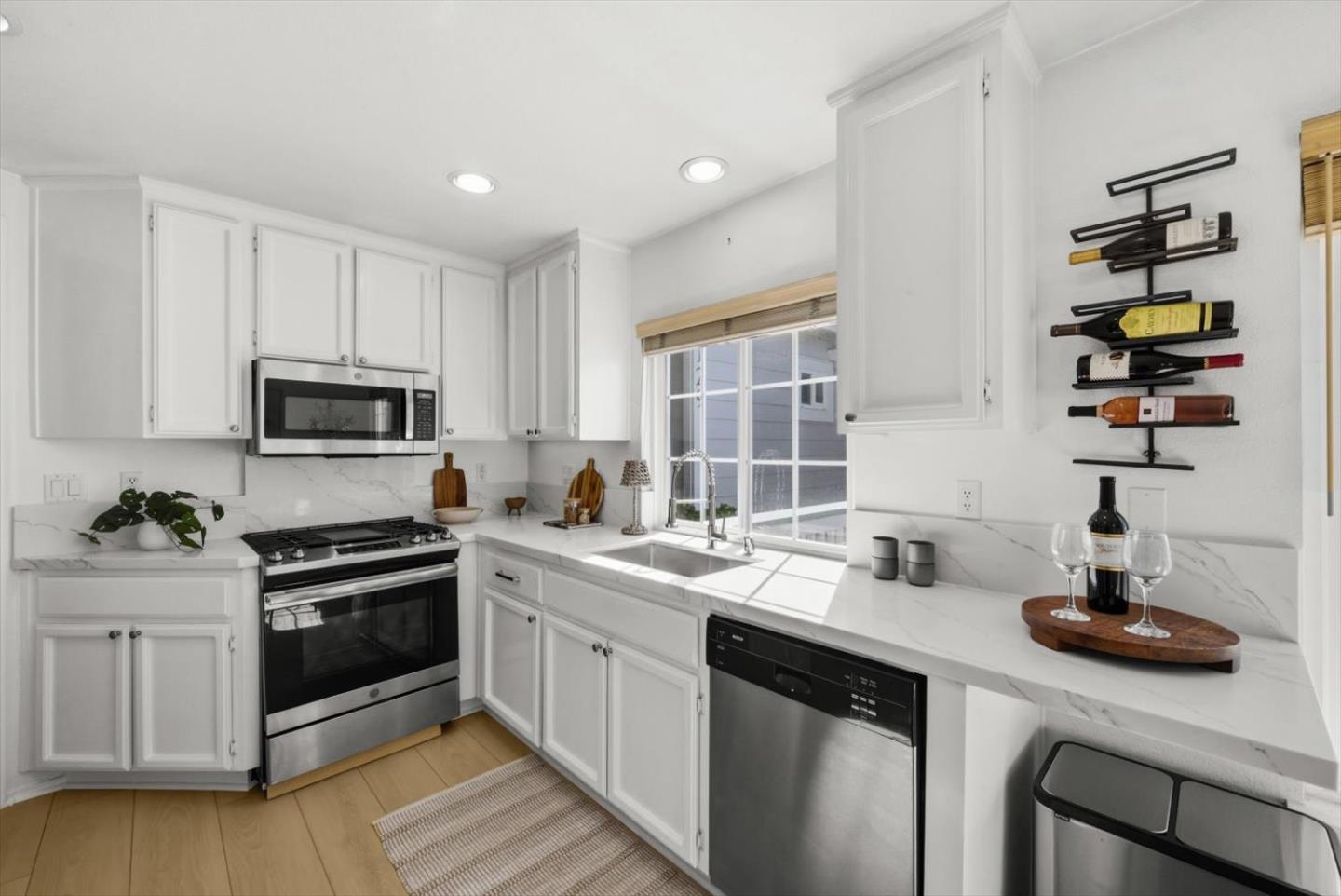 129 Outlook Circle Pacifica, CA 94044 - Photo 16 of 52 a kitchen with a sink stove and cabinets