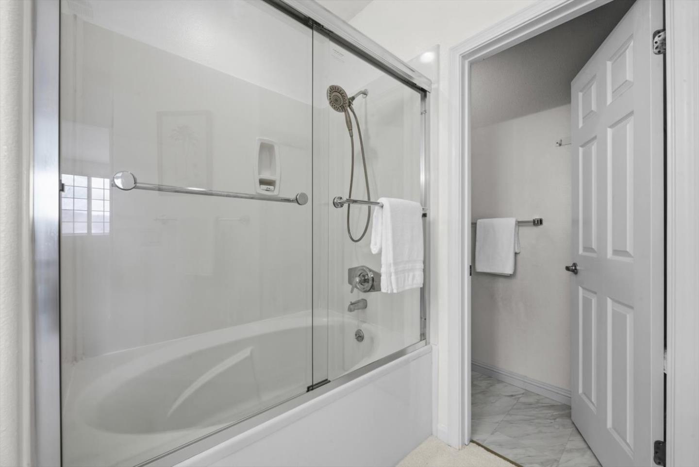 129 Outlook Circle Pacifica, CA 94044 - Photo 26 of 52 a bathroom with a glass shower door