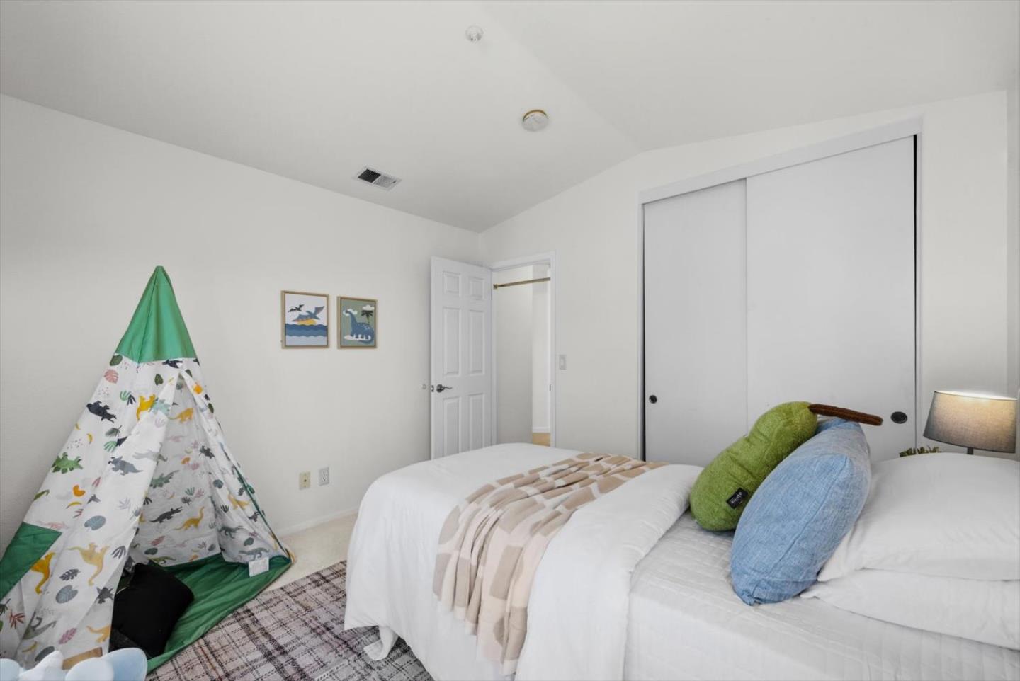 129 Outlook Circle Pacifica, CA 94044 - Photo 31 of 52 a bedroom with a bed and a window