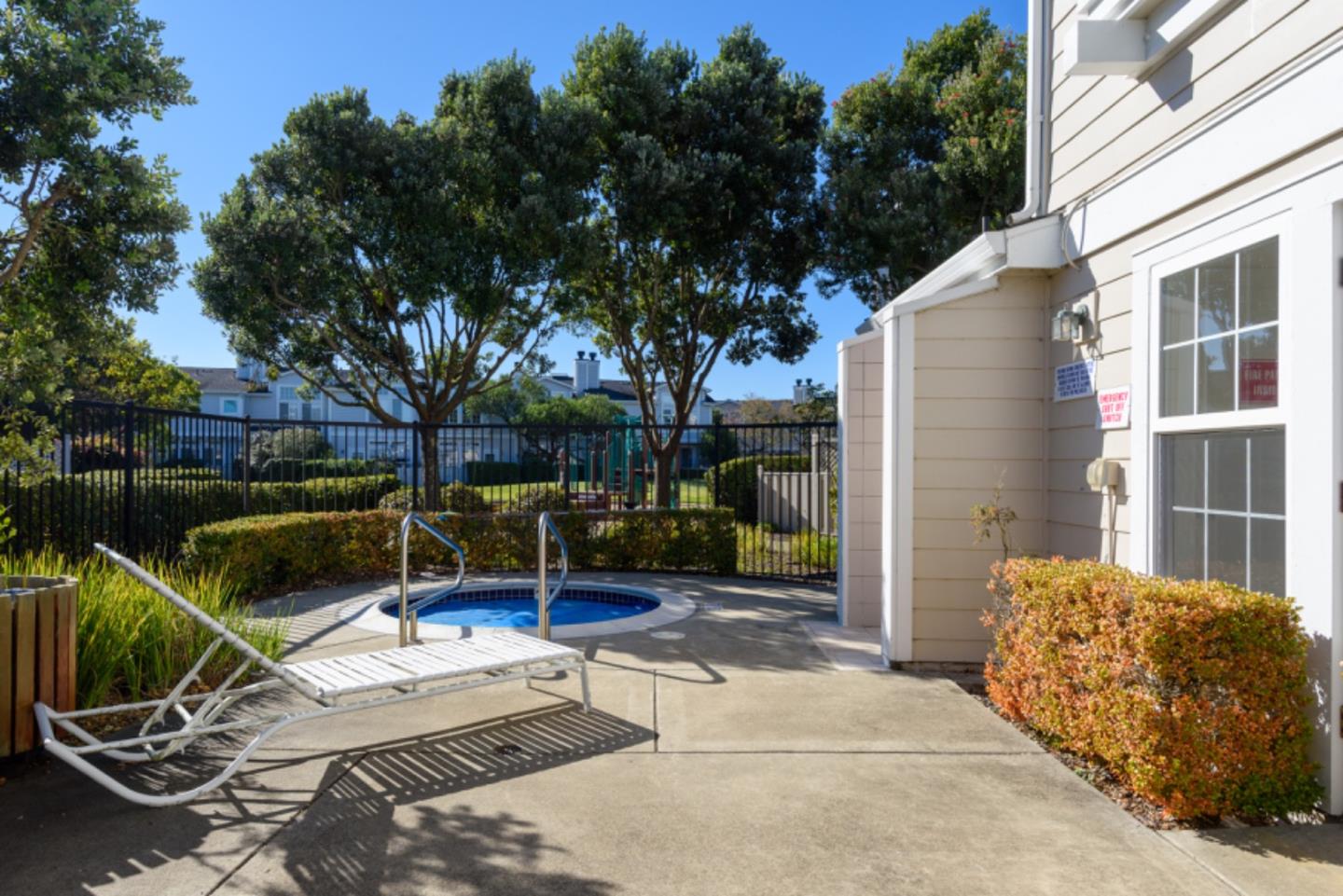 129 Outlook Circle Pacifica, CA 94044 - Photo 40 of 52 a view of a backyard with chairs and a fire pit
