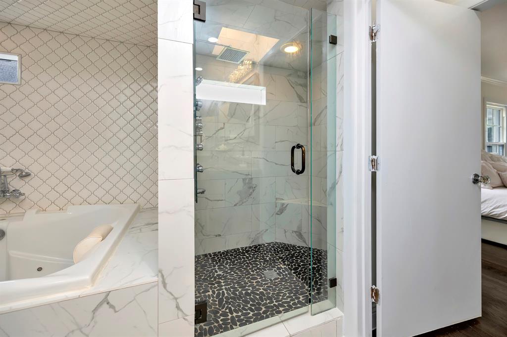 3413 Westcliff Road South Fort Worth, TX 76109 - Photo 17 of 26 a bathroom with a bathtub and shower