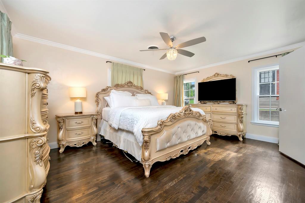 3413 Westcliff Road South Fort Worth, TX 76109 - Photo 19 of 26 a bedroom with a bed and wooden floor