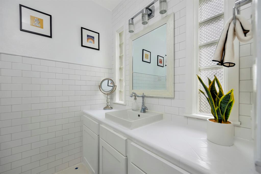 3413 Westcliff Road South Fort Worth, TX 76109 - Photo 24 of 26 a bathroom with a sink a vanity and a shower