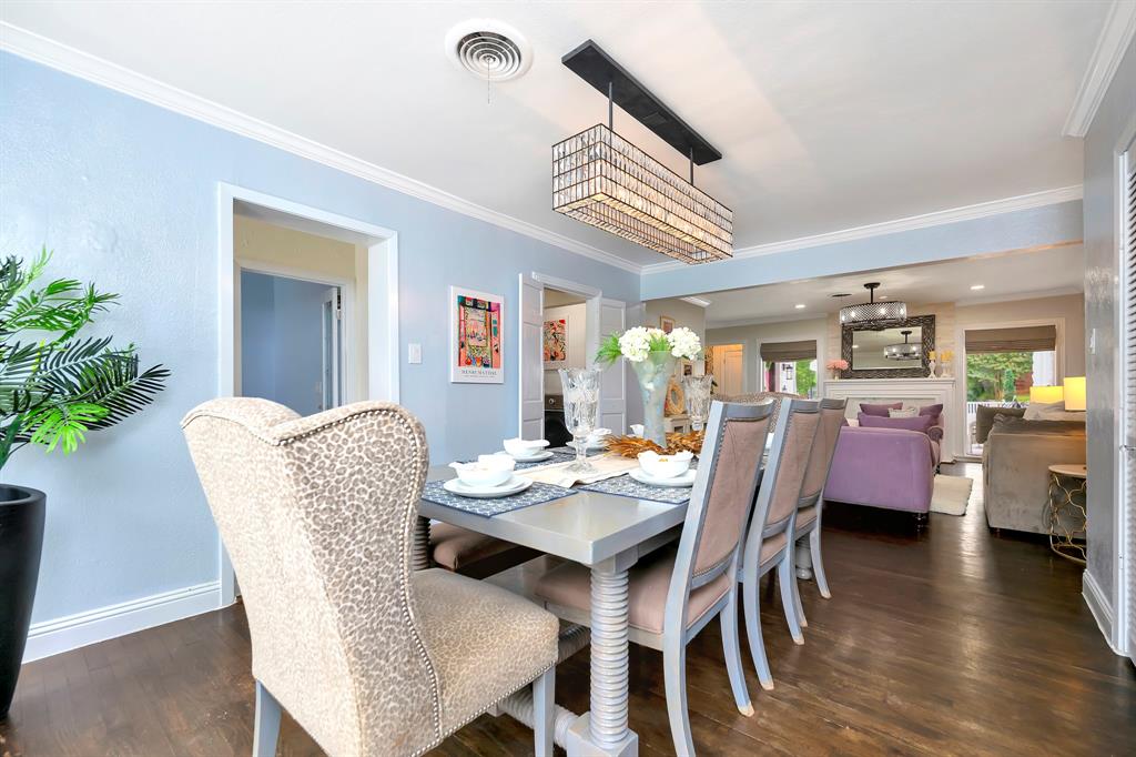 3413 Westcliff Road South Fort Worth, TX 76109 - Photo 6 of 26 a dining room with furniture potted plants and wooden floor
