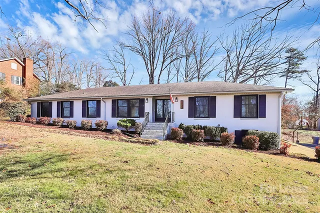a front view of a house with yard outdoor seating and barbeque oven