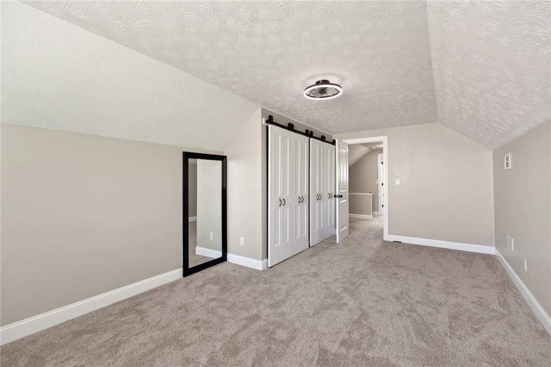 5975 Rosalie Road Dayton, OH 45424 - Photo 28 of 48 This versatile bonus room features a vaulted ceiling and ample storage, creating a bright and airy atmosphere.