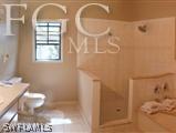 23401 Tuckahoe Road Alva, FL 33920 - Photo 8 of 15 a bathroom with a granite countertop shower a mirror and a sink