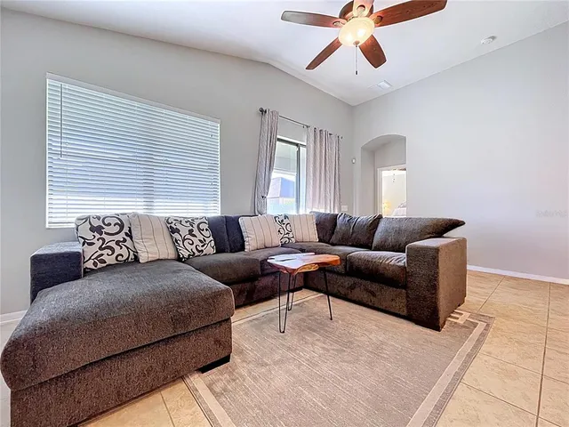 a bedroom with a bed and a painting