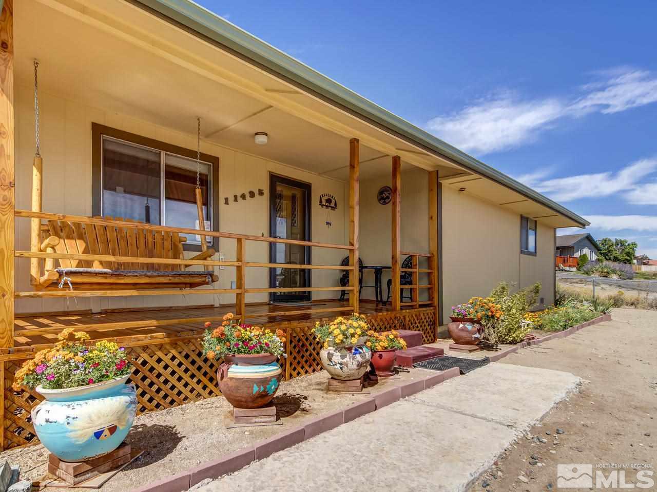 11495 Carlsbad Road Reno, NV 89508 - Photo 3 of 25 a front view of a house with outdoor seating