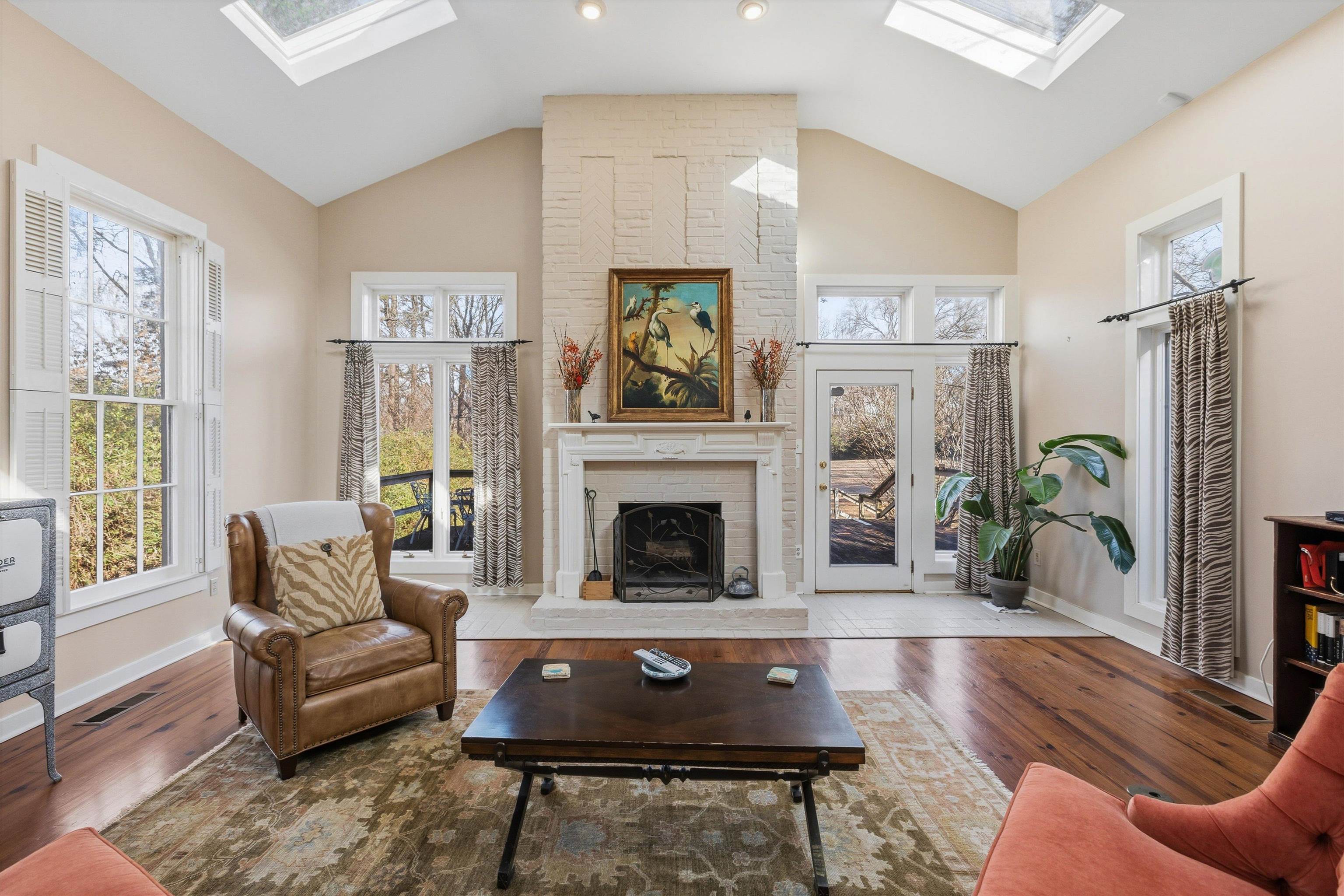 8516 Dogwood Road Germantown, TN 38139 - Photo 15 of 40 Primary suite ( currently used as den ) with 6 skylights, working fireplace and rear deck.