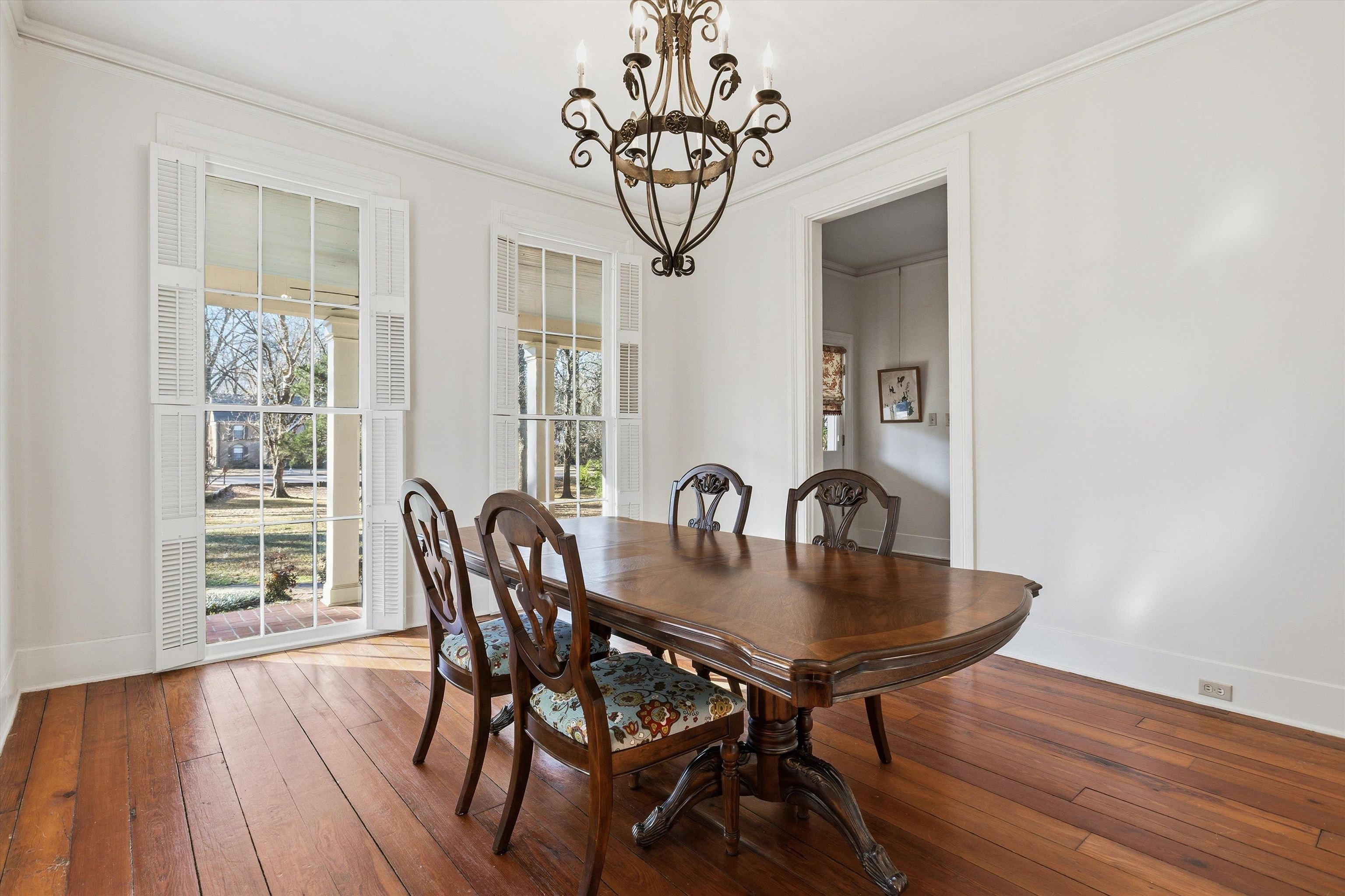8516 Dogwood Road Germantown, TN 38139 - Photo 7 of 40 Dining room w/ floor to ceiling windows and decorative fireplace.