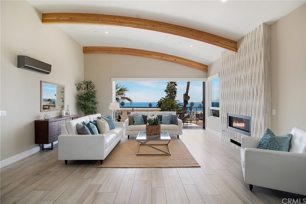 The one-level Penthouse features high open arched ceiling with custom wood beams.
