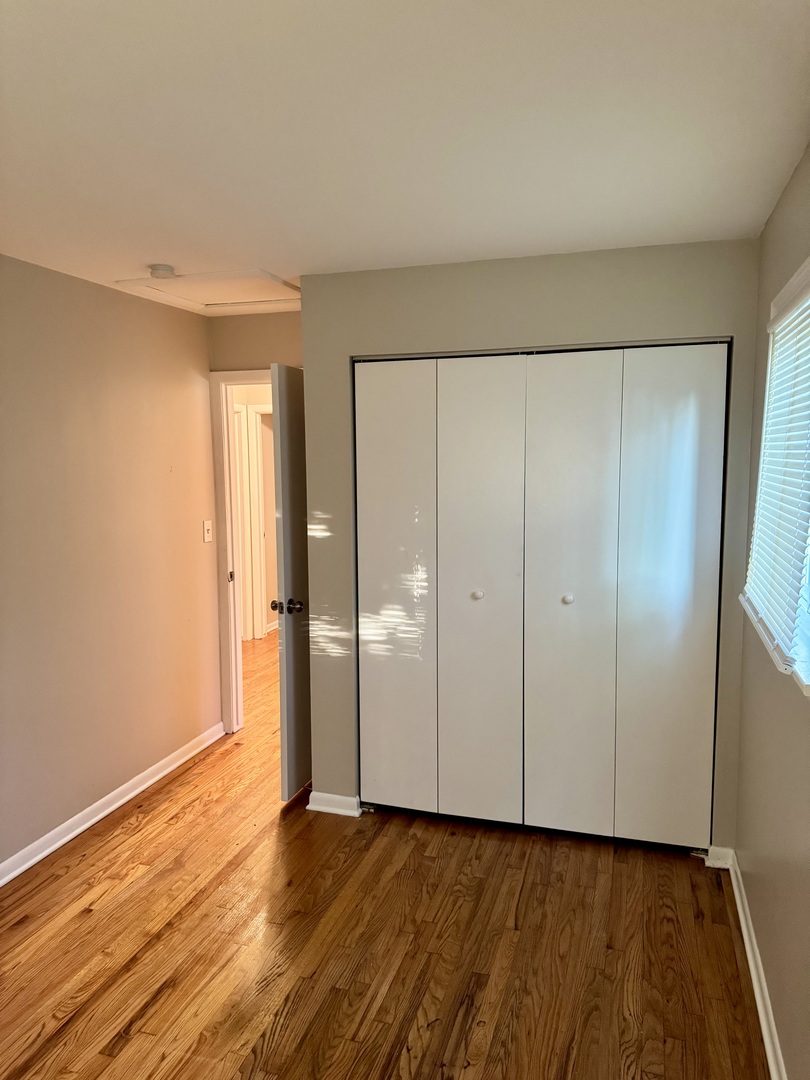 16919 Western Avenue Hazel Crest, IL 60429 - Photo 12 of 21 a view of an empty room with wooden floor