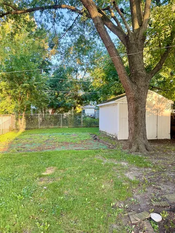 a backyard of a house with lots of green space