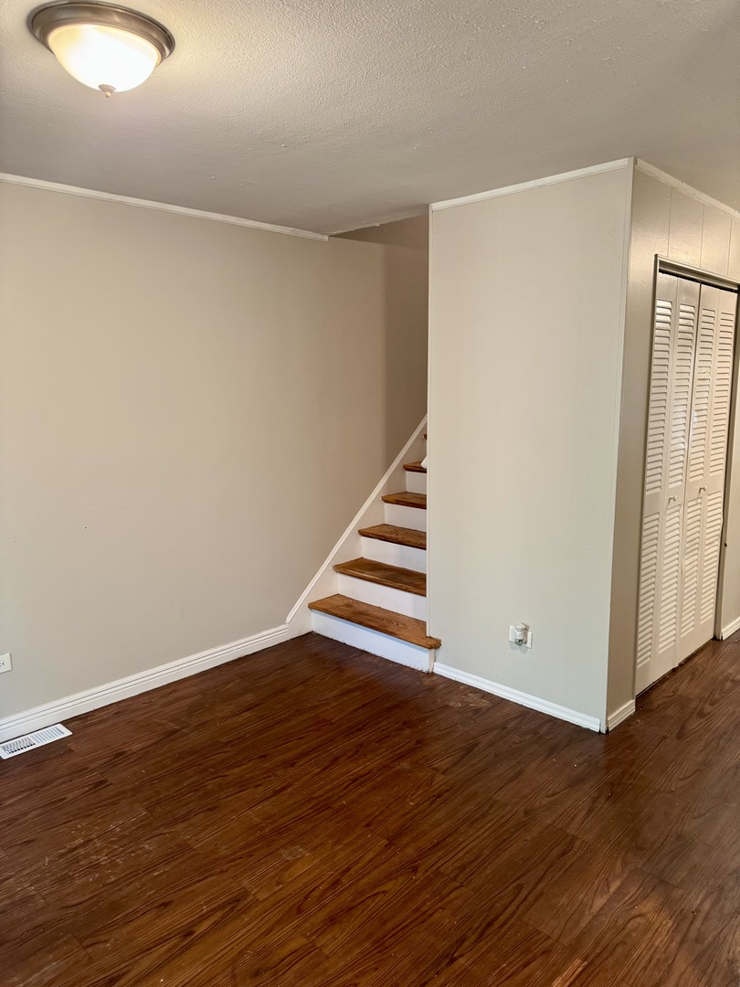 16919 Western Avenue Hazel Crest, IL 60429 - Photo 7 of 21 a view of an empty room with wooden floor