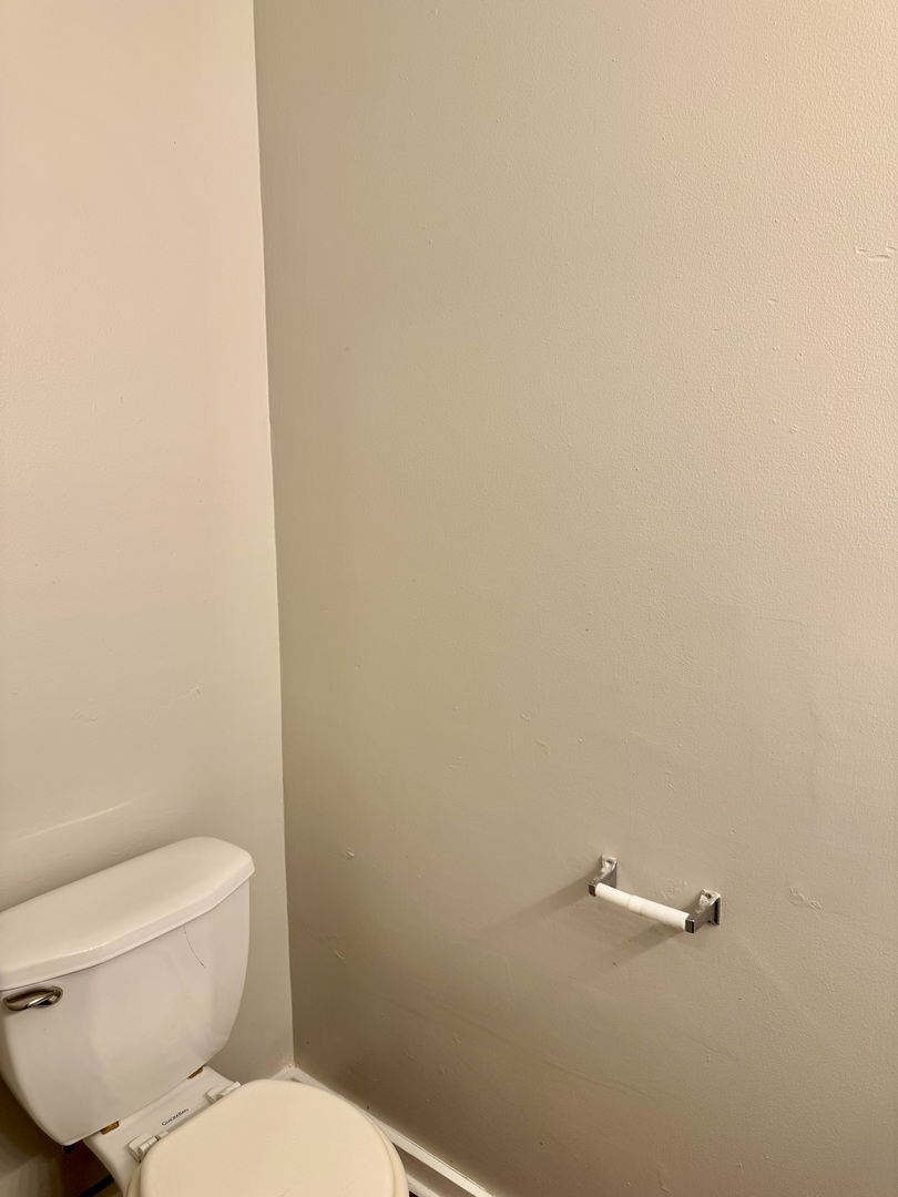 16919 Western Avenue Hazel Crest, IL 60429 - Photo 10 of 21 a white toilet sitting next to a white wall