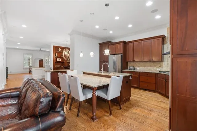 a spacious bedroom with a bed and furniture