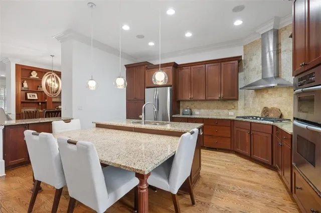 a view of a livingroom with a chandelier fan