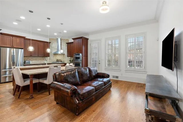 a bathroom with a granite countertop tub shower and sink