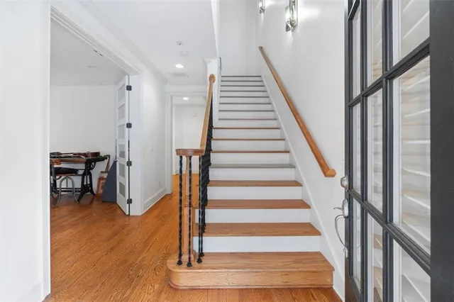 a view of an entryway with wooden floor