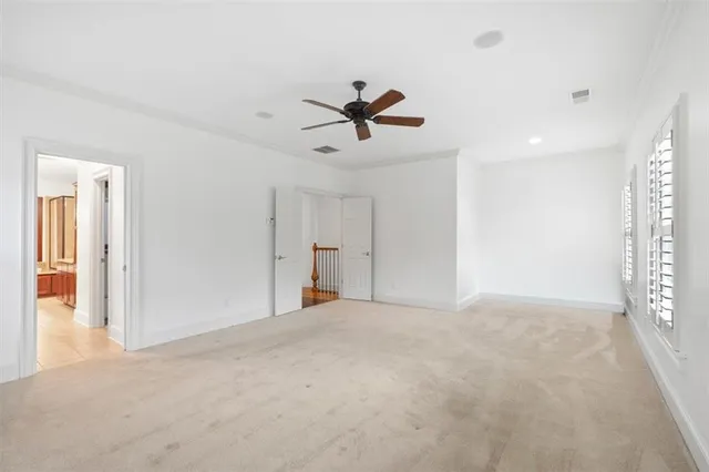 a bathroom with a bathtub shower sink vanity mirror and toilet