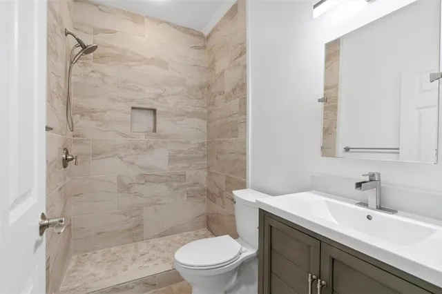 an aerial view of a house with garden space and street view