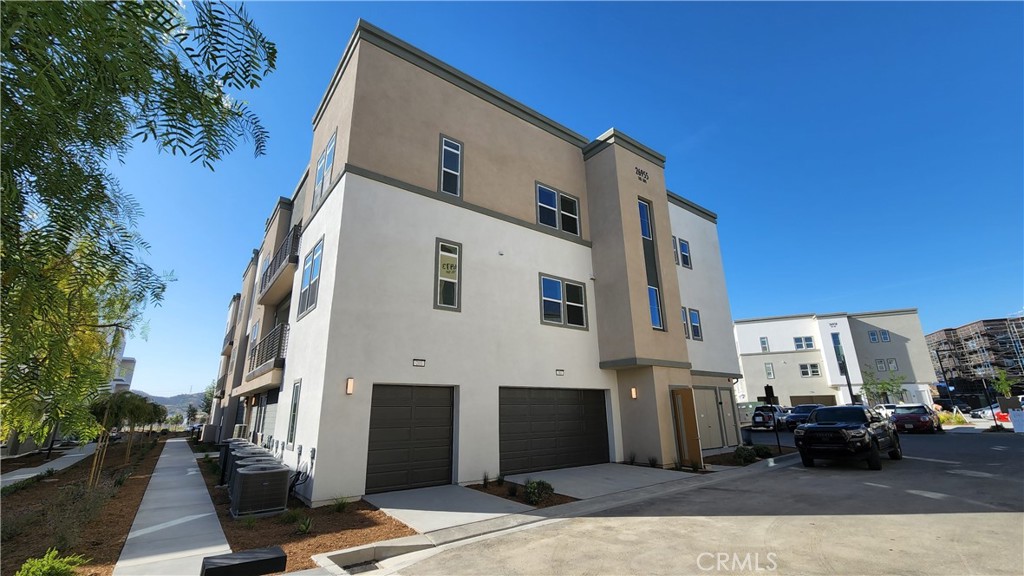 26955 West Prospector Road, Unit 201 Valencia, CA 91381 - Photo 1 of 30 a view of a building along with street