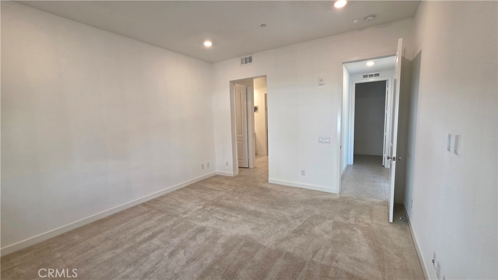 26955 West Prospector Road, Unit 201 Valencia, CA 91381 - Photo 15 of 30 an empty room with closet and a bathroom