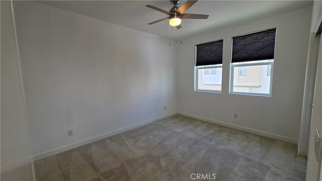 26955 West Prospector Road, Unit 201 Valencia, CA 91381 - Photo 19 of 30 an empty room with a window and a fan