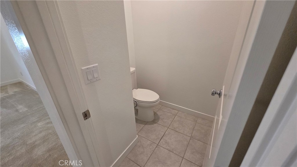 26955 West Prospector Road, Unit 201 Valencia, CA 91381 - Photo 25 of 30 a bathroom with a sink and a toilet