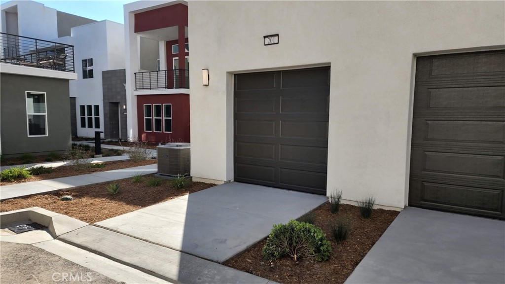 26955 West Prospector Road, Unit 201 Valencia, CA 91381 - Photo 27 of 30 a front view of a house