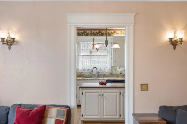 a view of kitchen with furniture and wooden floor