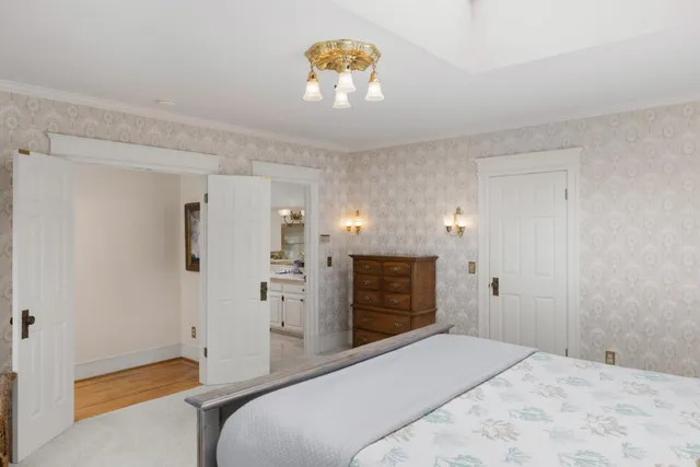 a spacious bedroom with a bed and a shower