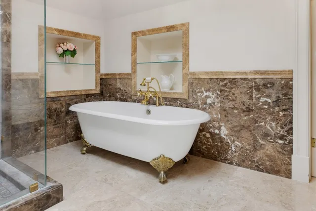 a white bath tub sitting in a bathroom
