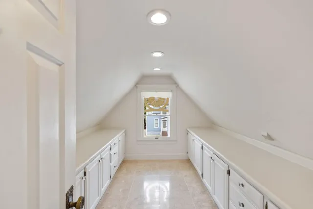 a view of a hallway with windows