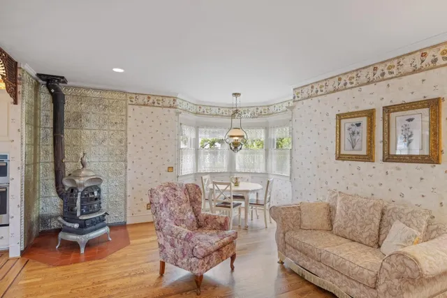 a living room with furniture and a glass door