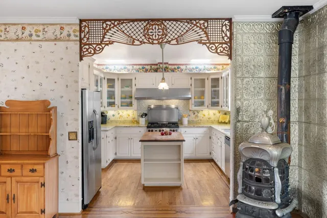 a kitchen with stainless steel appliances granite countertop a stove and refrigerator