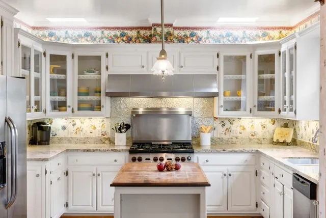 a kitchen with a stove and a sink