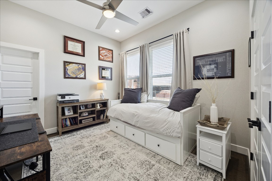 824 Morris Street Houston, TX 77009 - Photo 19 of 27 a bedroom with a bed and a dresser