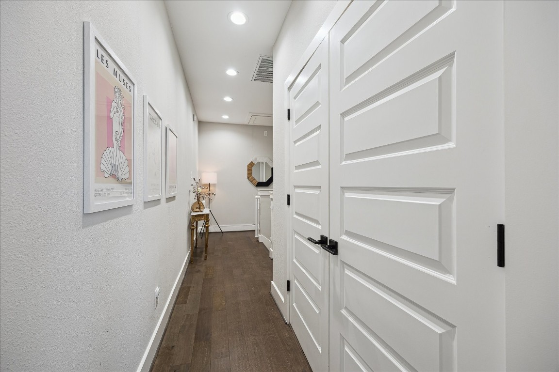 824 Morris Street Houston, TX 77009 - Photo 23 of 27 a view of a hallway with wooden floor and staircase