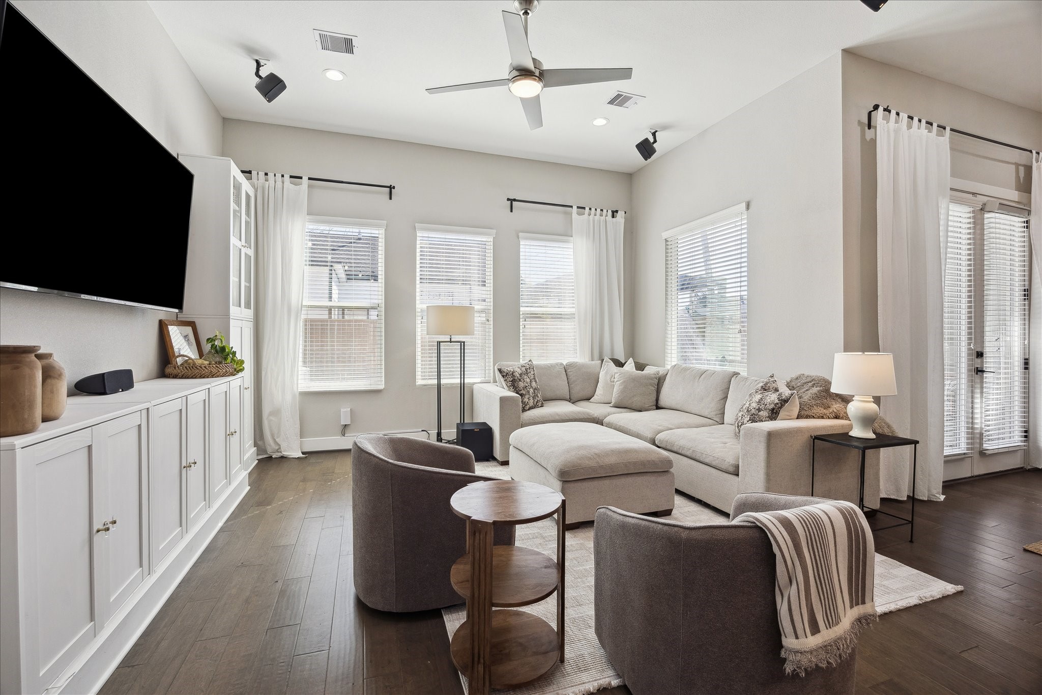 824 Morris Street Houston, TX 77009 - Photo 6 of 27 a living room with furniture a flat screen tv and a large window