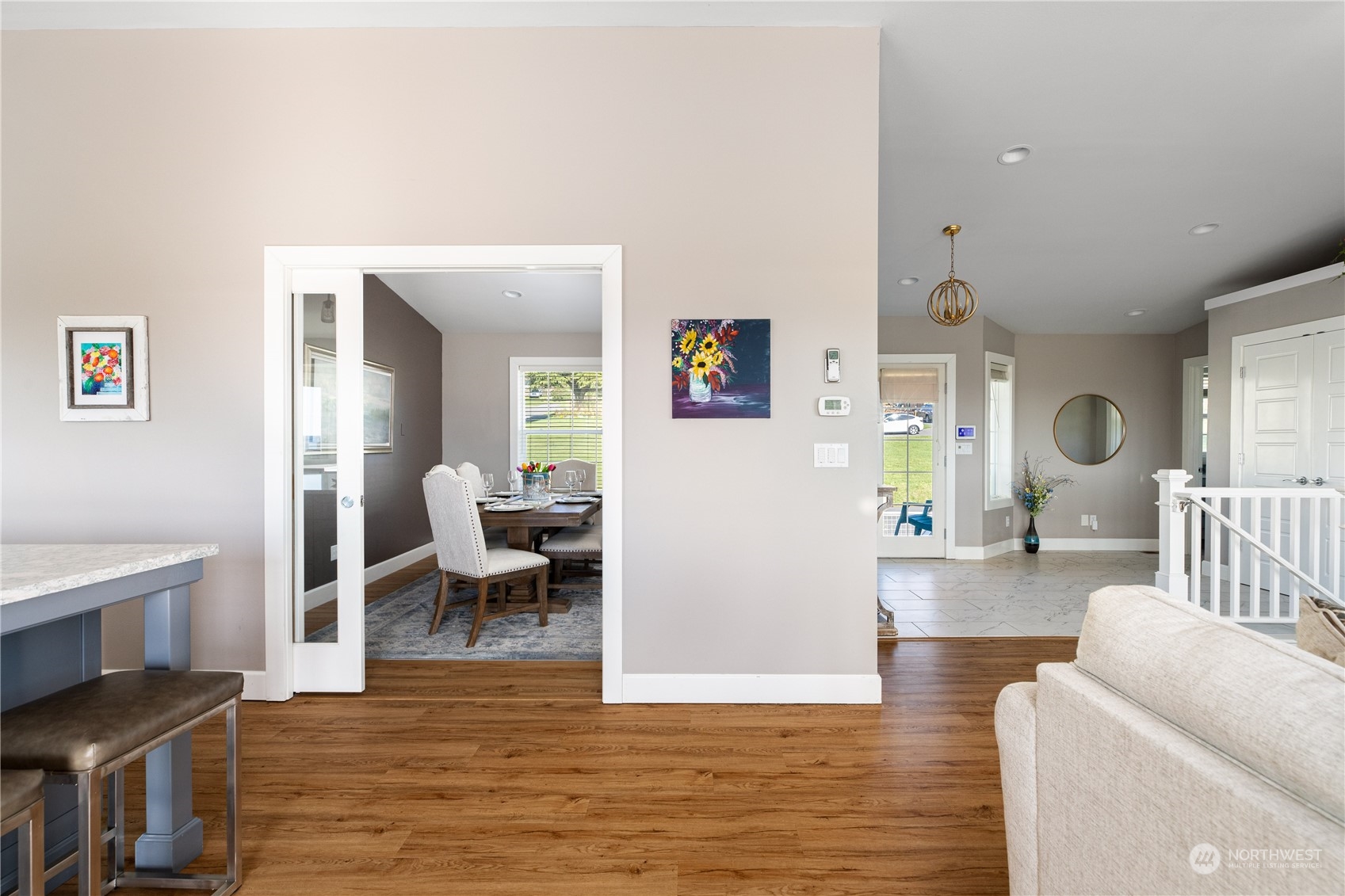 246 Lighthouse Way Freeland, WA 98249 - Photo 12 of 40 a living room with furniture and a wooden floor