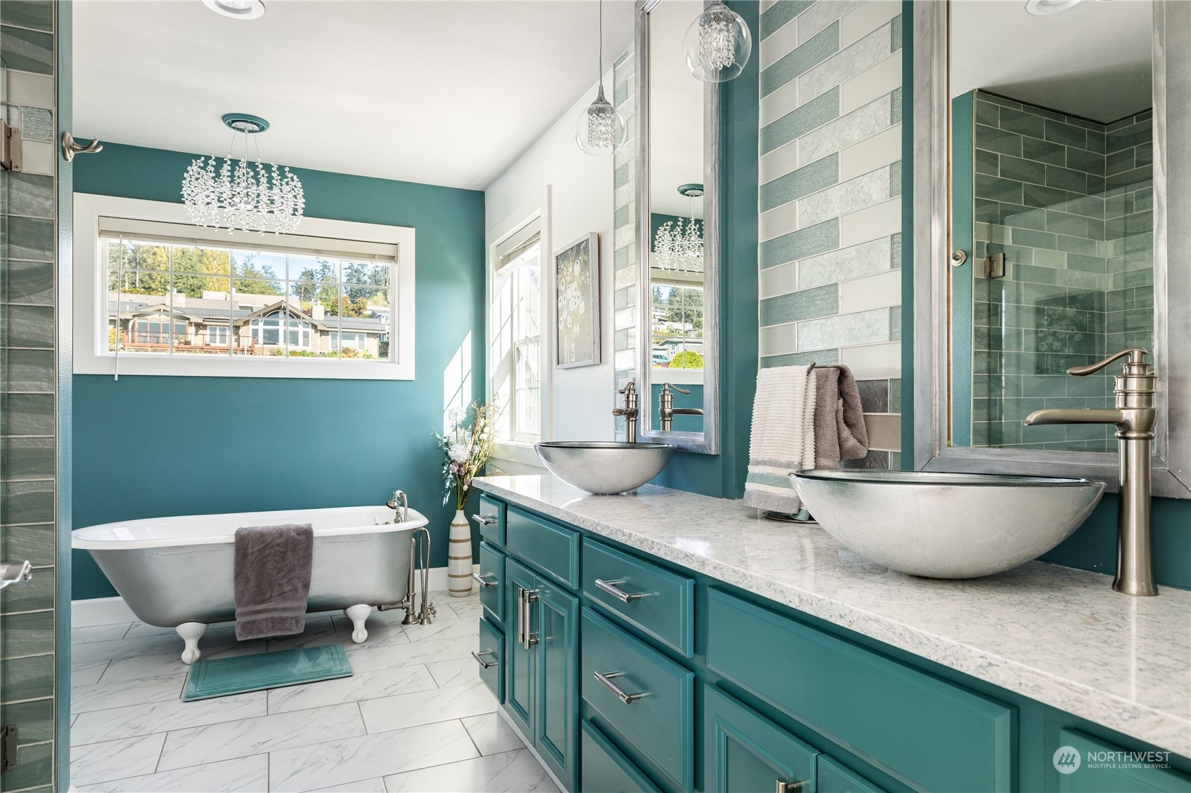 246 Lighthouse Way Freeland, WA 98249 - Photo 18 of 40 a spacious bathroom with a double vanity sink a mirror and a bathtub