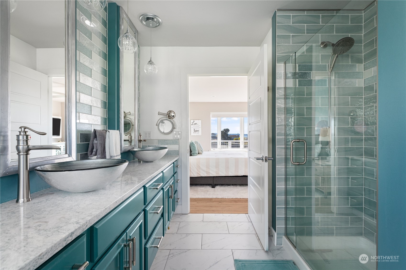 246 Lighthouse Way Freeland, WA 98249 - Photo 20 of 40 a bathroom with a granite countertop sink a toilet a mirror and shower
