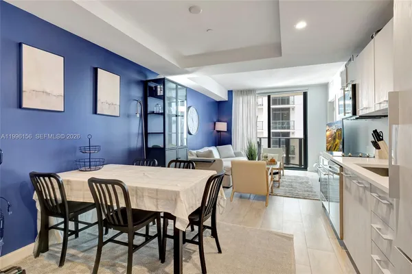 a kitchen with cabinets stainless steel appliances and a counter space