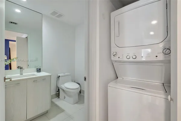a kitchen with a sink a stove and cabinets